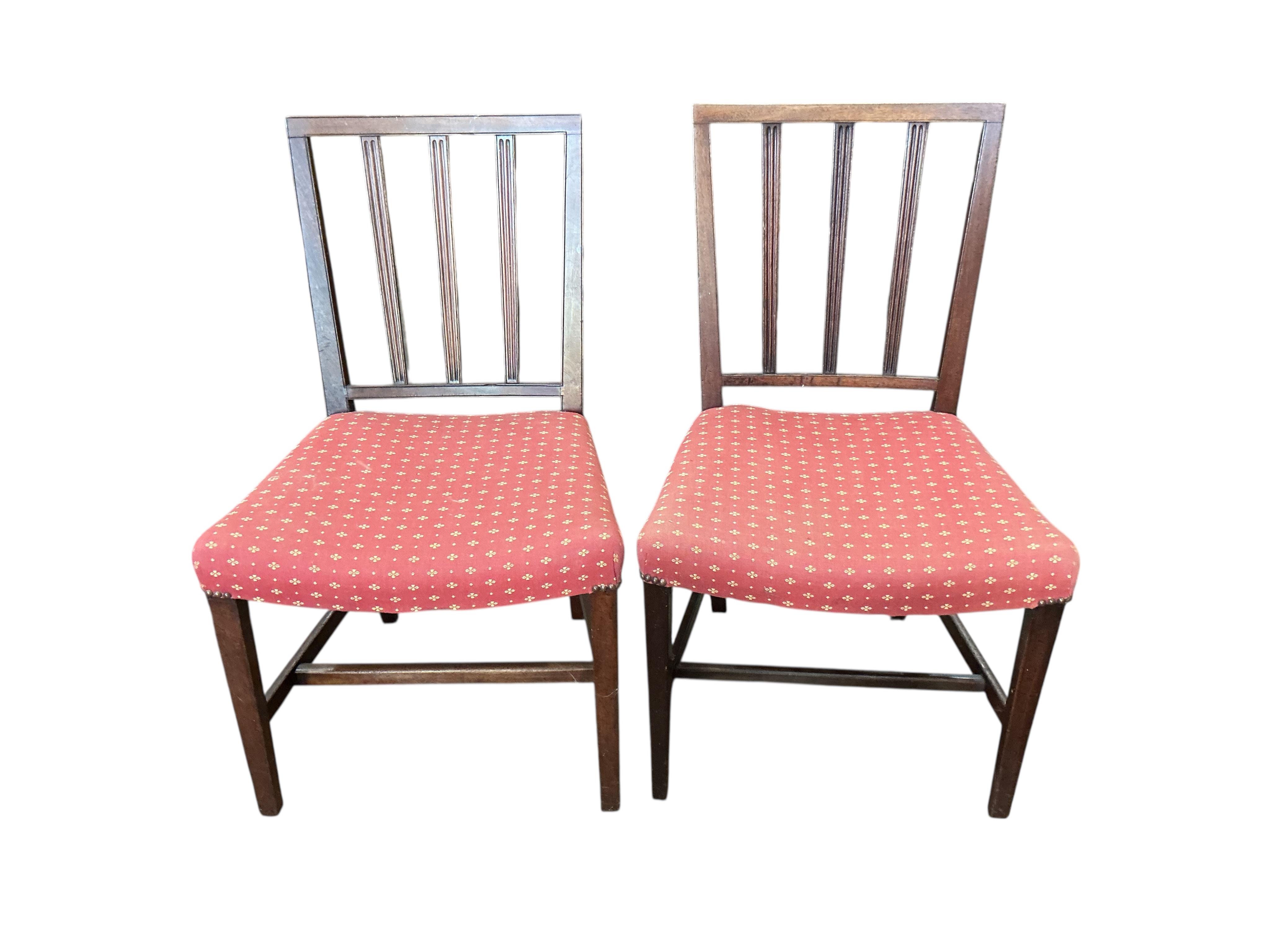A set of four George III mahogany dining chairs